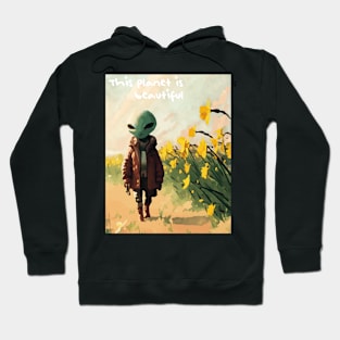 Alien walking through a vast field of yellow daffodils 2 Hoodie